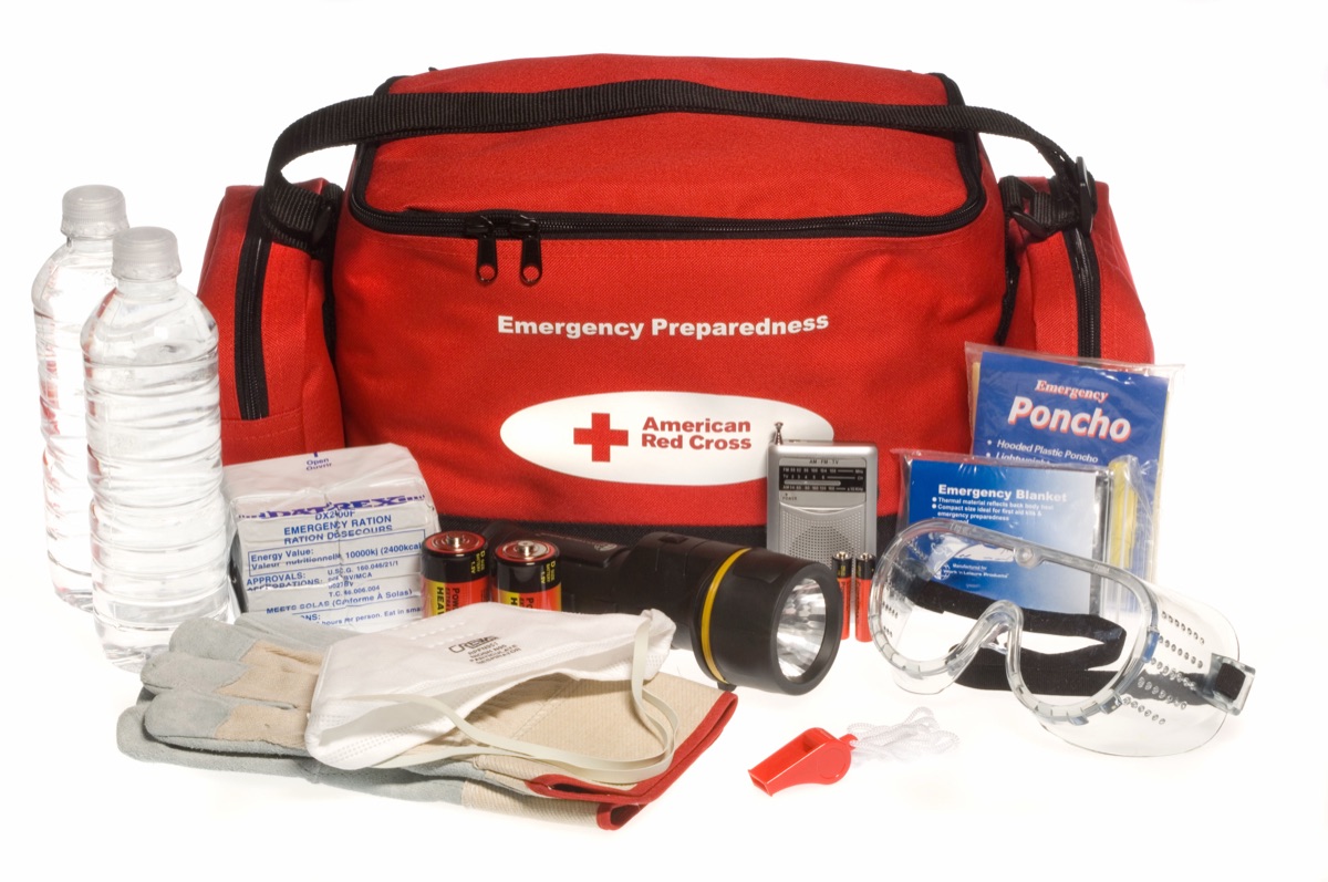 A Red Cross ready-to-go emergency preparedness kit with its contents laid out